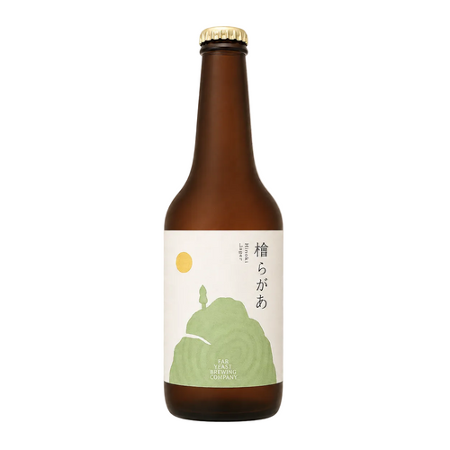 A brown glass bottle of sake with a white label featuring a green mountain illustration and Japanese text, topped with a gold cap, shown on a checkered gray background.